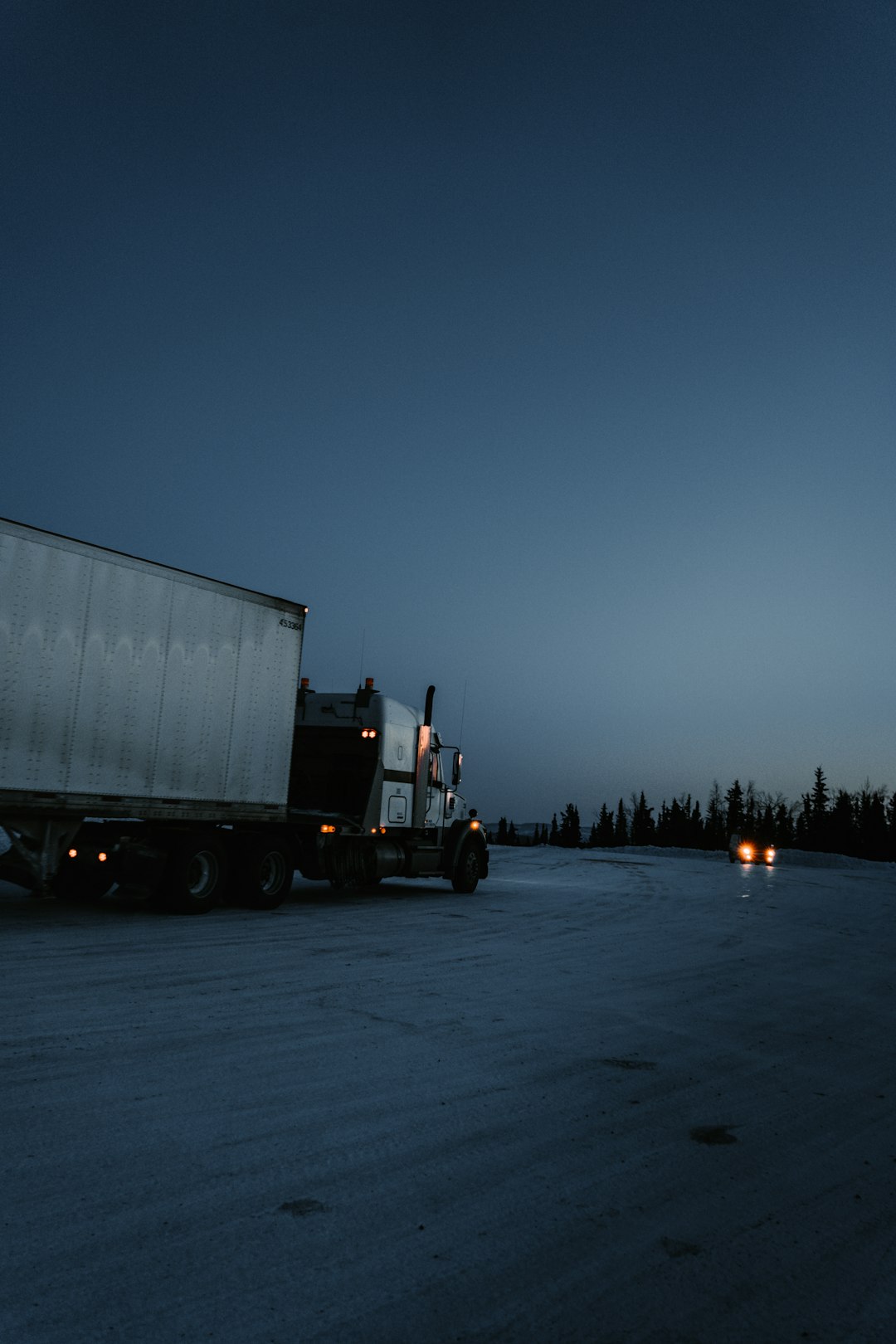 why-choose-us white-and-black-freight-truck-traveling-on-road-zp5uth4v7yy