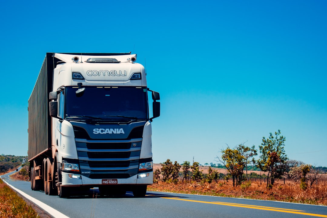 white-truck-on-road-during-daytime-gbvdile8yvi